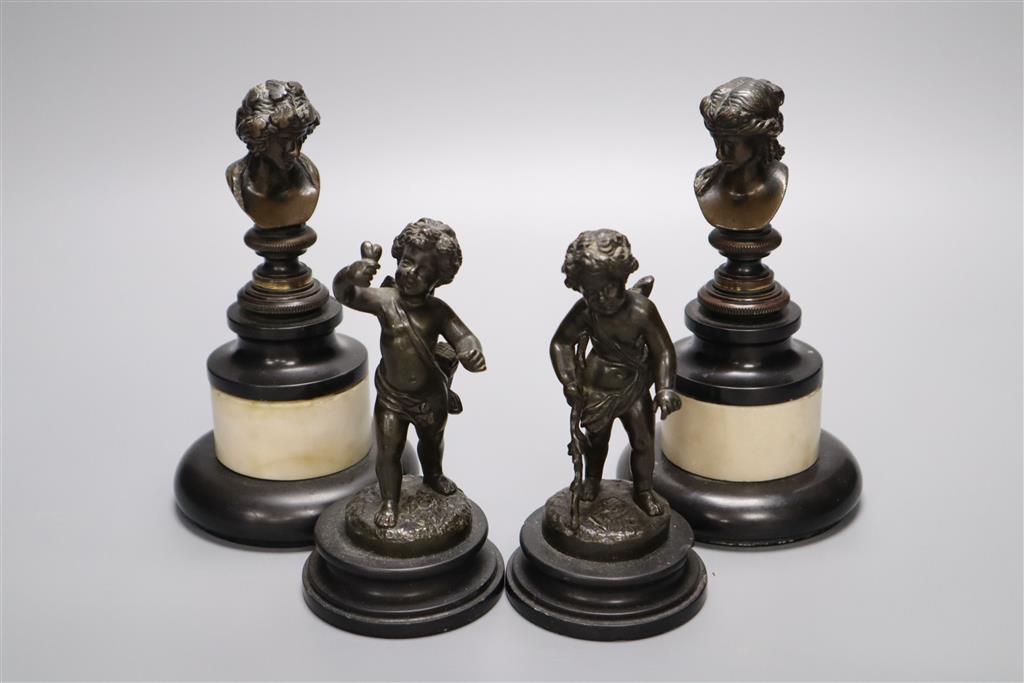 A pair of Regency small bronze busts and a pair of figures of cherubs, tallest 16cm